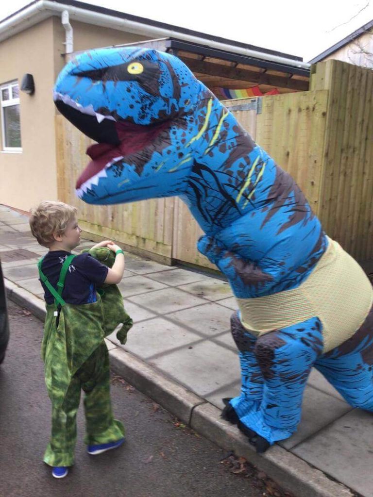 blue dinosaur with student