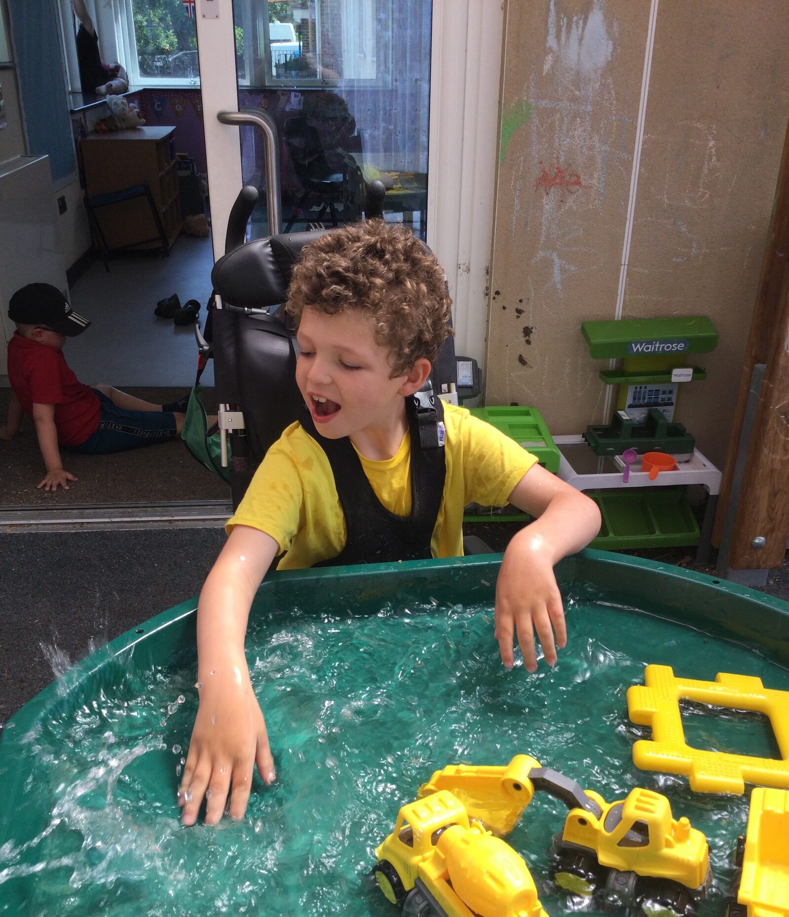 boy playing with water