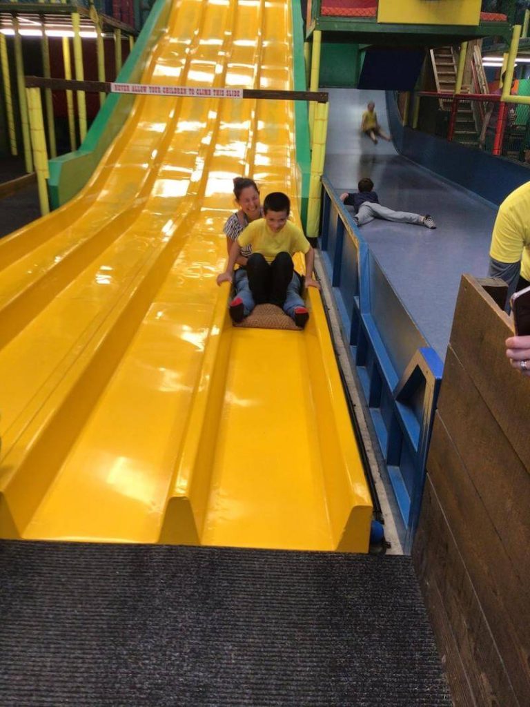 student and teacher on slide